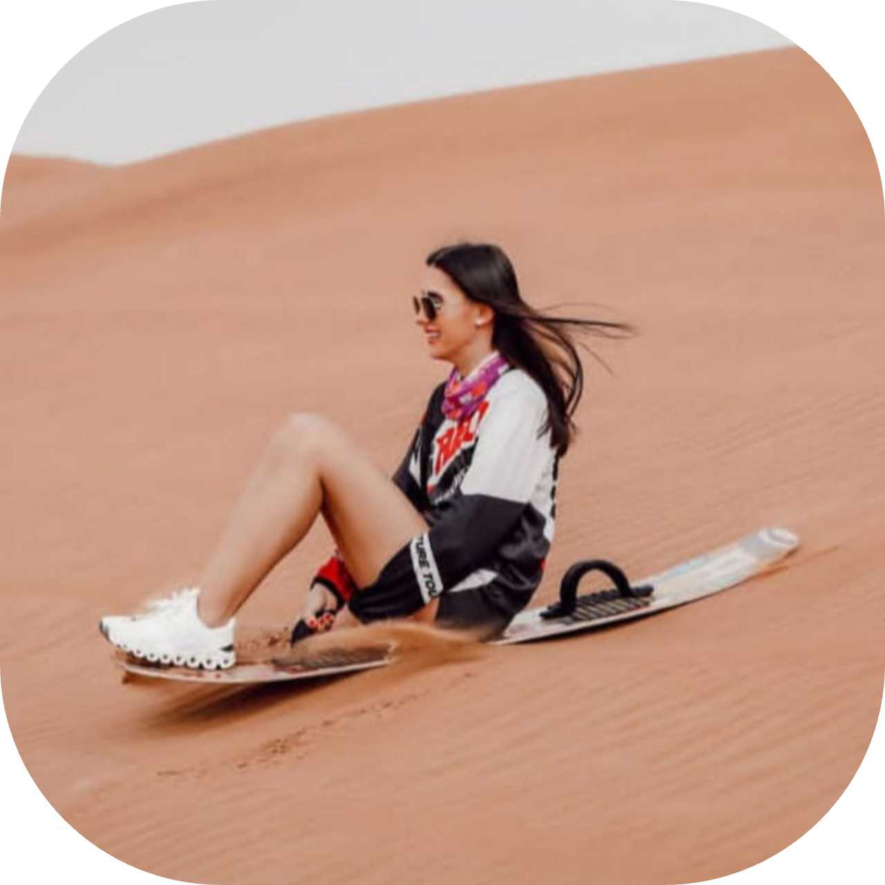 Sandboarding activity down the high Erg Chebbi dunes in Morocco